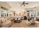 Expansive living room with ceiling fan, neutral tones, and open floor plan at 6621 N Arizona Biltmore Cir, Phoenix, AZ 85016