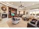 Inviting living room with fireplace, custom shelving, and comfortable seating at 6621 N Arizona Biltmore Cir, Phoenix, AZ 85016