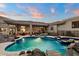 Sparkling pool and spa with views of the house, patio and backyard at 6621 N Arizona Biltmore Cir, Phoenix, AZ 85016