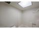 Clean bathroom features a shower, tub and bright ceiling light at 10 E Betty Elyse Ln, Phoenix, AZ 85022