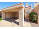 Exterior view of the carport shows the number 10, storage, and nearby landscaping at 10 E Betty Elyse Ln, Phoenix, AZ 85022