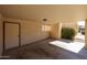 Carport features an attached storage area and access to outdoor landscaping at 10 E Betty Elyse Ln, Phoenix, AZ 85022