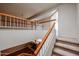 Carpeted stairway leads to a living room with a fireplace at 10 E Betty Elyse Ln, Phoenix, AZ 85022