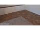 Finished basement area has built-in storage cabinets and carpet and tile flooring at 1024 W Ayrshire Trl, San Tan Valley, AZ 85143