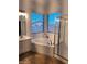 This bright bathroom offers a soaking tub, tiled floor, and separate walk-in shower at 1024 W Ayrshire Trl, San Tan Valley, AZ 85143