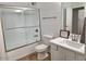 Bright bathroom with tub/shower, white cabinets and modern fixtures at 1024 W Ayrshire Trl, San Tan Valley, AZ 85143