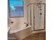 Bright bathroom featuring a shower, soaking tub, and modern fixtures at 1024 W Ayrshire Trl, San Tan Valley, AZ 85143