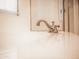 Bright bathroom sink featuring brushed nickel faucet and large window providing ample natural light at 1024 W Ayrshire Trl, San Tan Valley, AZ 85143
