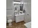 Bathroom with white vanity, modern mirror and fixtures and tiled floors at 1024 W Ayrshire Trl, San Tan Valley, AZ 85143