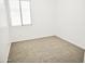 Bedroom with plush carpet, neutral walls, and window at 1024 W Ayrshire Trl, San Tan Valley, AZ 85143