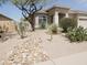Attractive single-story home featuring a beautiful desert landscaped front yard at 1024 W Ayrshire Trl, San Tan Valley, AZ 85143