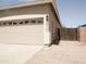 Oversized three car garage with a side gate access, plus desert landscaping at 1024 W Ayrshire Trl, San Tan Valley, AZ 85143