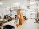 Spacious, cluttered garage providing ample storage with multiple racks and a garage door at 1024 W Ayrshire Trl, San Tan Valley, AZ 85143