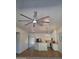 Open kitchen with large island, stainless appliances, and modern lighting at 1024 W Ayrshire Trl, San Tan Valley, AZ 85143