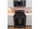 Close up of stainless steel oven and range against white cabinets and tile backsplash at 1024 W Ayrshire Trl, San Tan Valley, AZ 85143