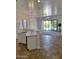 Open kitchen with breakfast bar, stainless appliances and sliding glass door to backyard at 1024 W Ayrshire Trl, San Tan Valley, AZ 85143