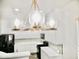 Bright kitchen featuring a stylish chandelier, white cabinets, and modern appliances at 1024 W Ayrshire Trl, San Tan Valley, AZ 85143