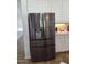 Modern stainless steel refrigerator with water dispenser and bright white cabinets at 1024 W Ayrshire Trl, San Tan Valley, AZ 85143