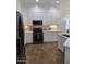 Renovated kitchen featuring modern appliances, countertops, and ample cabinet space at 1024 W Ayrshire Trl, San Tan Valley, AZ 85143