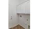 Laundry room with overhead cabinets and tile flooring at 1024 W Ayrshire Trl, San Tan Valley, AZ 85143