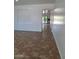 Spacious living area featuring tile floors and open archway at 1024 W Ayrshire Trl, San Tan Valley, AZ 85143