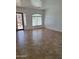 Bright living room with tile flooring and large window offering natural light at 1024 W Ayrshire Trl, San Tan Valley, AZ 85143