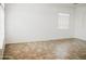 Bright living room with neutral paint, tile floors, and large window providing ample natural light at 1024 W Ayrshire Trl, San Tan Valley, AZ 85143