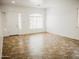 Bright living room with neutral paint, tile floors, and large window providing ample natural light at 1024 W Ayrshire Trl, San Tan Valley, AZ 85143