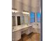 Primary bathroom featuring double sinks, large mirror, and a separate tub and shower at 1024 W Ayrshire Trl, San Tan Valley, AZ 85143