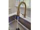 Close up of a sink with a modern faucet and running water at 1024 W Ayrshire Trl, San Tan Valley, AZ 85143