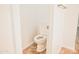 Clean, tiled bathroom with a toilet situated between an open doorway, ready for customization at 1024 W Ayrshire Trl, San Tan Valley, AZ 85143