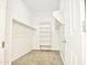 Walk-in closet with shelving and a hanging rack for organization at 1024 W Ayrshire Trl, San Tan Valley, AZ 85143