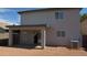 The backyard features a covered patio with a sliding glass door and a gravel ground at 11218 W Glenrosa Ave, Phoenix, AZ 85037
