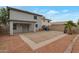 Spacious backyard features a covered patio, desert landscaping, and a privacy fence at 11218 W Glenrosa Ave, Phoenix, AZ 85037