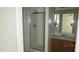 Clean bathroom featuring a glass shower, vanity with a mirror, and neutral finishes at 11218 W Glenrosa Ave, Phoenix, AZ 85037