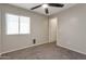 Bedroom featuring neutral walls, carpet, and ceiling fan at 11218 W Glenrosa Ave, Phoenix, AZ 85037