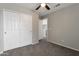Bedroom featuring neutral walls, carpet and double door closet at 11218 W Glenrosa Ave, Phoenix, AZ 85037