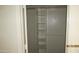 Spacious closet featuring built-in shelving, a hanging rod, and a white door at 11218 W Glenrosa Ave, Phoenix, AZ 85037