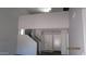 Spacious entryway featuring light gray walls, carpeted floors, and white doors at 11218 W Glenrosa Ave, Phoenix, AZ 85037