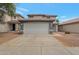 Traditional two-story home featuring a two-car garage and desert landscaping at 11218 W Glenrosa Ave, Phoenix, AZ 85037