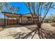 Charming home with a covered porch, carport, and low-maintenance landscaping at 115 S Stardust Ln, Apache Junction, AZ 85120