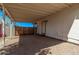 Spacious covered patio featuring gravel flooring, providing an ideal space for outdoor activities at 115 S Stardust Ln, Apache Junction, AZ 85120