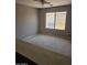 Neutral bedroom featuring carpeted floors, ceiling fan, and window with bright natural light at 11760 N 153Rd Ave, Surprise, AZ 85379