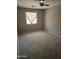 Neutral bedroom with carpet, ceiling fan, and window for natural light at 11760 N 153Rd Ave, Surprise, AZ 85379