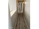 Clean and well-maintained hallway with modern wood flooring and neutral wall paint at 11760 N 153Rd Ave, Surprise, AZ 85379