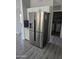 Modern kitchen featuring stainless steel refrigerator and complementary granite countertops at 11760 N 153Rd Ave, Surprise, AZ 85379