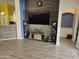 Modern living room with wood flooring, media center and recessed lighting at 11760 N 153Rd Ave, Surprise, AZ 85379
