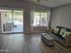 Comfortable living room with access to the pool area, stylish furniture, and bright natural light at 11760 N 153Rd Ave, Surprise, AZ 85379