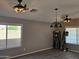 Spacious living room featuring modern ceiling fans, recessed lighting, and neutral wall paint at 11760 N 153Rd Ave, Surprise, AZ 85379