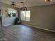 Spacious living area featuring wood flooring and large windows, providing ample natural light at 11760 N 153Rd Ave, Surprise, AZ 85379